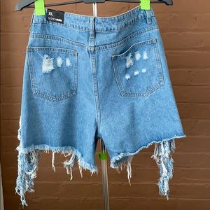 Distressed fringe denim shorts.